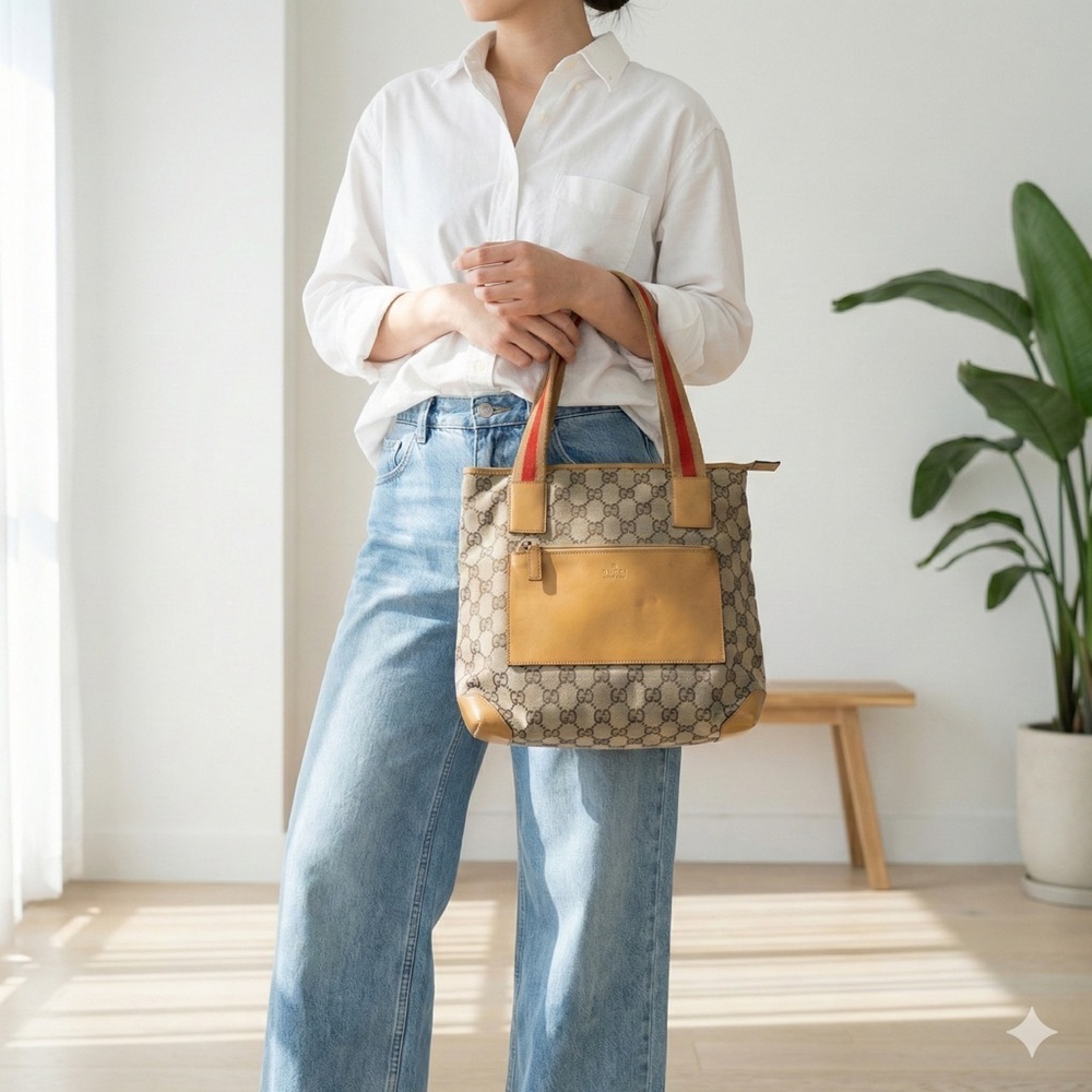 Vintage Gucci brown GG canvas tote with tan leather trim and red web straps